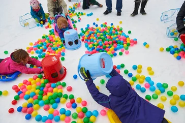 Snow activities and ski enthusiasts enjoying a winter day at Mt. Buller